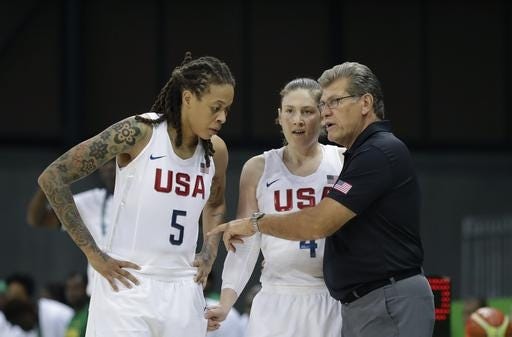 United States women's basketball coach Geno Auriemma gives instructions to Seimone Augustus (5) and Lindsay Whalen (4) during the U.S.'s 121-56 rout of Senegal on Sunday. CARLOS OSORIO/THE ASSOCIATED PRESS