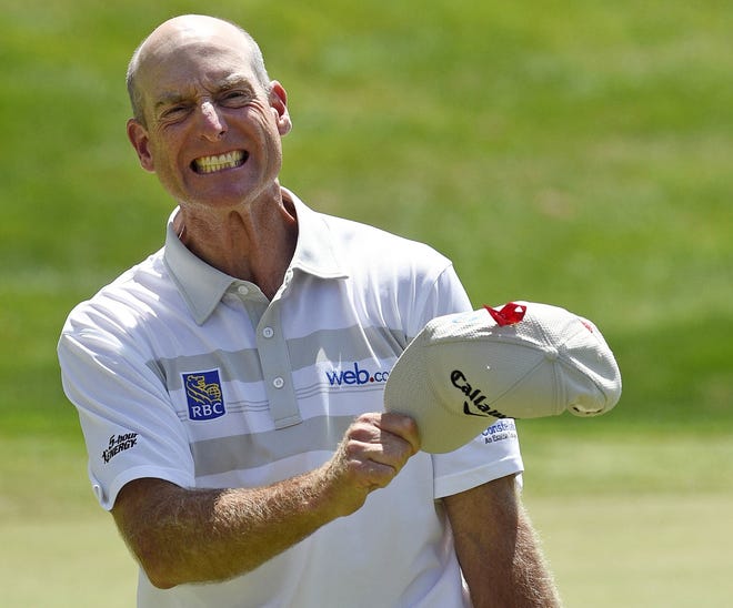 Jim Furyk celebrates after shooting a course and PGA-record 58 during the final round of the Travelers Championship on Sunday. AP Photo