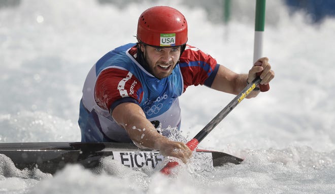 Casey Eichfeld of the United States competes during the canoe single men's heats of the canoe slalom at the Rio Summer Olympics on Sunday. (AP Photo/Kirsty Wigglesworth)