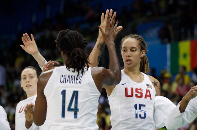 U.S. center Tina Charles is congratulated by center Brittney Griner during their game against Senegal in Rio de Janeiro, Brazil, on Sunday.