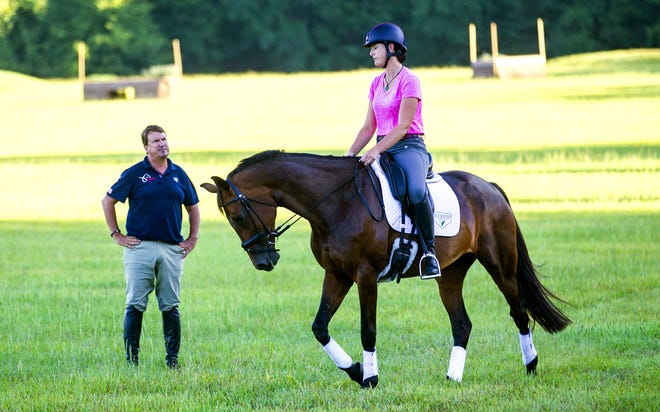 Coach David O'Connor talks with Lauren Kieffer after her ride during practice as the U.S. Olympic Eventing team practices dressage at O'Conner Equestrian on July 25. The team, which has riders from several areas of the country, was in sixth place after the dressage component on Sunday.  Alan Youngblood / Star-Banner