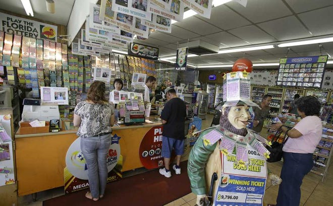 AP Customers purchase Powerball tickets in 2013 at a convenience store in Orlando.