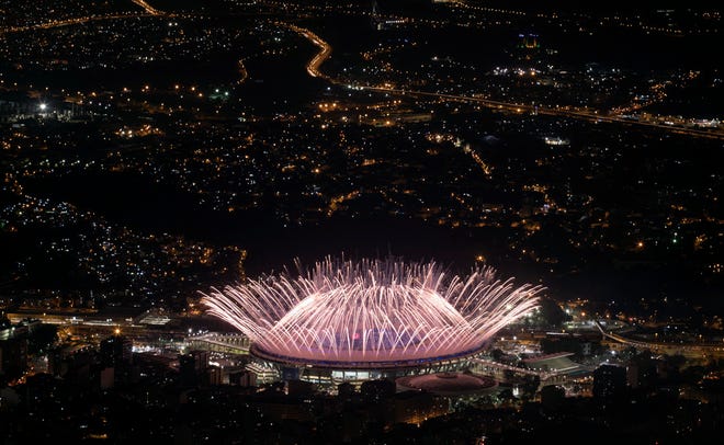 In this Aug. 5, 2016 photo, fireworks explode over Maracana Stadium during the opening ceremony at the 2016 Summer Olympics in Rio de Janeiro, Brazil. Hillary Clinton has the airwaves all to herself during the Rio Olympics. Her Democratic presidential campaign is spending more than $13.6 million on TV commercials during the three weeks of the Summer Games. Republican Donald Trump hasn't put up a single general election ad yet. (AP Photo/Felipe Dana)