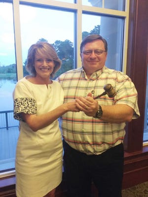 Jeanne Dailey passed the gavel to incoming president Jason Belcher.