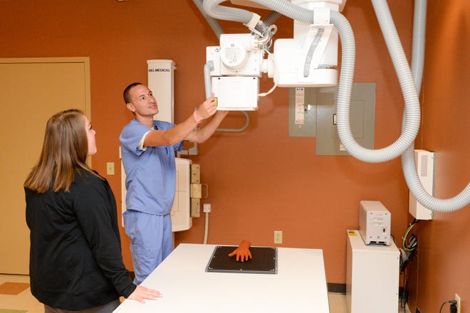 Ashley Arbaugh and Anthony Brown learn about the new radiology equipment inside the Mercy Health Center located at 2935 Lincoln Way W in Massillon. Watch video from the new facility, which will host an open house Friday and begin taking patients Monday, at IndeOnline.com.

(GateHouse Ohio Media / Michael Balash)
