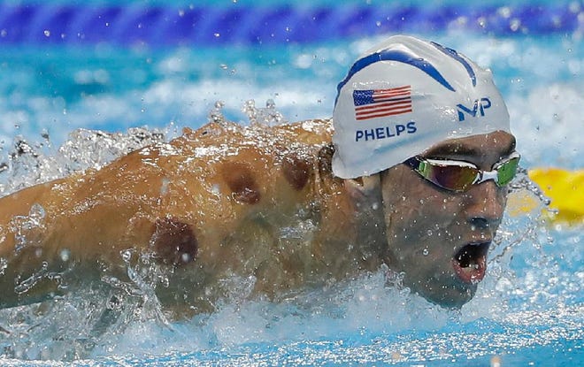 The United States' Michael Phelps competes in a heat of the men's 200-meter butterfly during the swimming competition at the 2016 Summer Olympics, Monday, Aug. 8, 2016, in Rio de Janeiro, Brazil. (AP Photo/Matt Slocum)