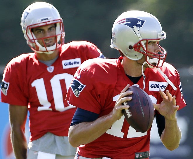 The division of reps between Tom Brady (foreground) and Jimmy Garoppolo is one thing to look for when the Patriots open the preseason against the Saints on Thursday night.