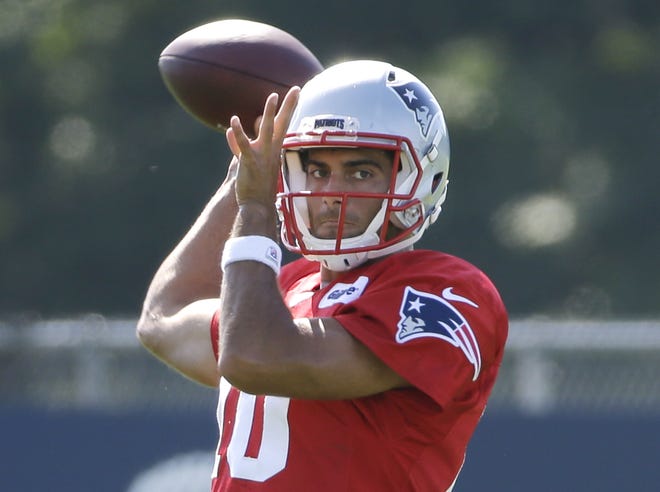 Patriots quarterback Jimmy Garoppolo throws a pass during Tuesday's joint practice with the Saints.