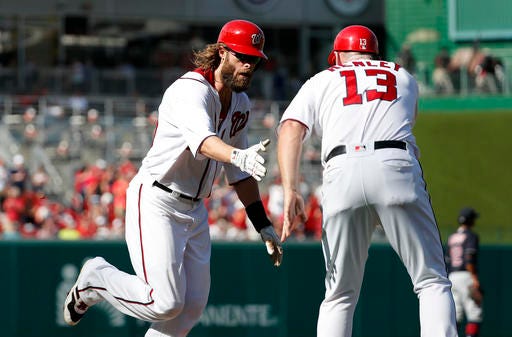 Washington Nationals' Jayson Werth, left, is congratulated by third base coach Bob Henley (13) as he rounds the bases for his three-run homer during the second inning of a baseball game against the Cleveland Indians at Nationals Park, Wednesday, Aug. 10, 2016, in Washington. (AP Photo/Alex Brandon)