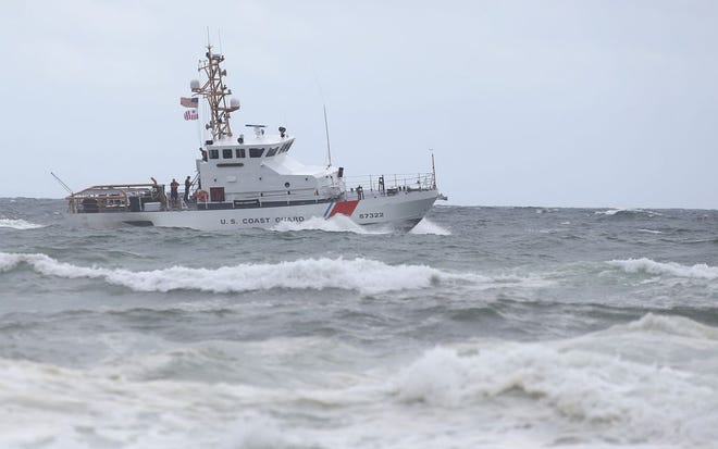 A Coast Guard boat searches for a missing swimmer in the Gulf of Mexico near Sunrise Condominiums. Multiple military and police teams searched Wednesday afternoon for the man, who witnesses said went into the water and did not resurface.