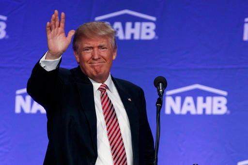 Republican presidential candidate Donald Trump waves after speaking to the National Association of Home Builders, Thursday, Aug. 11, 2016, in Miami Beach, Fla. (AP Photo/Evan Vucci)