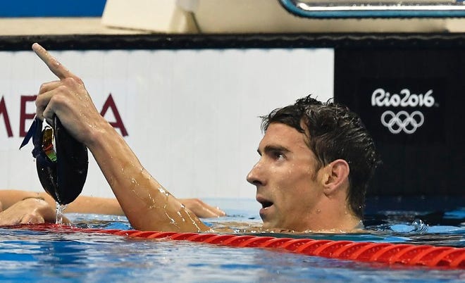 The United States' Michael Phelps celebrates after winning the gold medal during the men's 200-meter individual medley final during the swimming competition at the 2016 Summer Olympics, Thursday, Aug. 11, 2016, in Rio de Janeiro, Brazil. (AP Photo/Martin Meissner)