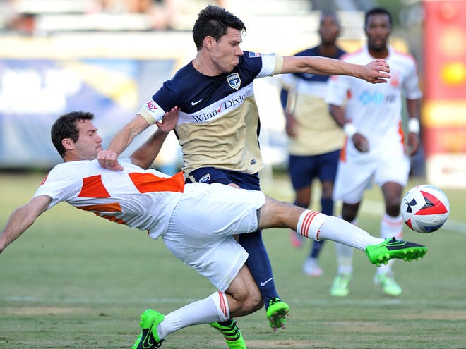 Alex Andersson and the Railhawks' Steven Miller fight for control of the ball August 6.