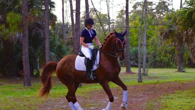 Although no one in Amy Speck-Kern’s family had ever ridden horses, the Loxahatchee Grove’s area woman will compete in a national dressage championship. (Photo provided)