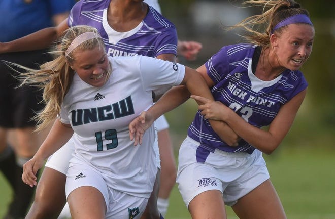 UNCW forward Nikki Cox (left) competes for possession during an exhibition match against High Point at UNCW Soccer Stadium in Wilmington, N.C. Thursday, August 11, 2016. Matt Born/StarNews