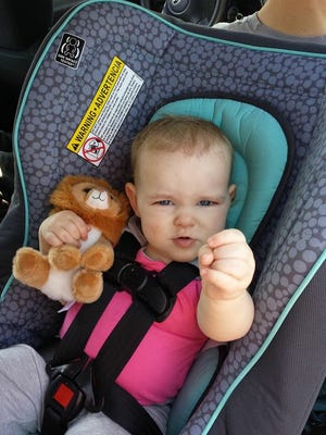 Alice Putman, 20-month-old daughter of Aaron and Cheryl Putman of Mercersburg, sits in a rear-facing car seat. A new state law says all kids need to be in a rear-facing seat until they are 2 or outgrow the seat.