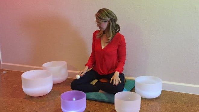 Lauren Foreman, one of the partners who own Austin’s Meditation Bar, plays signing bowls. “Statesman Shots” visited Meditation Bar to chat with Lauren about the importance of meditation and how the business has been doing since it opened last year.