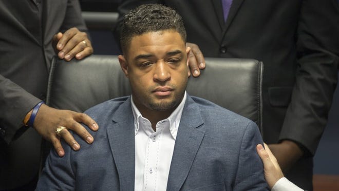 Pastor Jordan Brown takes a moment to compose himself as he is overcome with emotion during a press conference in April as he speaks about how he felt when he saw a gay slur on a cake he had ordered from Whole Foods. Pastor Jordan Brown and his attorney Austin Kaplan filed a law suit against Whole Foods. RICARDO B. BRAZZIELL/AMERICAN-STATESMAN