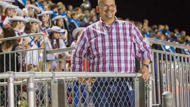 Dr. John Carter, Westlake High School principal, enjoys the drama of the strong rivallry between the Chaps and the Cavaliers at Lake Travis on Friday night, Oct. 24, 2014. PAUL BRICK FOR AUSTIN COMMUNITY NEWSPAPERS
