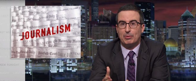 John Oliver: "It's pretty obvious that without newspapers to cite, TV news would just be Wolf Blitzer endlessly batting a ball of yarn around." (HBO/YouTube)