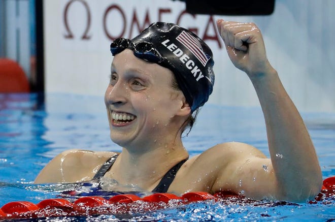 Unites States' Katie Ledecky celebrates after winning gold in the women's 800-meter freestyle final during the swimming competitions at the 2016 Summer Olympics, Friday, Aug. 12, 2016, in Rio de Janeiro, Brazil. (AP Photo/Julio Cortez)