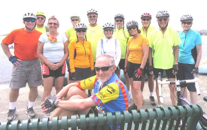 Senior cyclists find cooling breezes at Angelica Point in Mattapoisett. Standing left to right: Ed Fopiano of East Bridgewater, Jack Jacobsen of Fairhaven, Debbie Lepore of Canton, Rachel Thibeault of Brockton, Louise Anthony of Mattapoisett, Moe Botelho of Middleboro, Joanne Staniscia of Franklin, Paul Anthony of Mattapoisett, Nancy Beach of No. Attleboro , Bob Kalchthaler of Middleboro, Al Meserve of Raynham, Martha Pirone of Wrentham.
Seated in front: Hans Luwald of Walpole