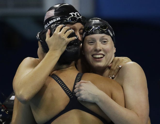 Dana Vollmer, center, Kathleen Baker, left, and Lilly King of the U.S. women's 4 x 100-meter medley relay team celebrate their gold medal during Saturday's final in Rio. It was the nation's 1,000th all-time Summer Olympics gold. AP Photo