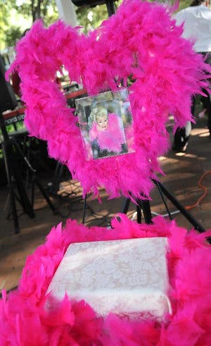 Nancy Hillis' ashes were surrounded by a hot pink boa, in the Whitefield Square gazebo. (Carl Elmore/For the Savannah Morning News)