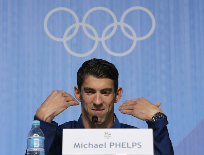 United States' Olympic swimmer Michael Phelps gestures as he restates his intention to retire at a news conference at the 2016 Summer Olympics in Rio de Janeiro, Brazil, on Sunday. Associated Press/Peter Morgan
