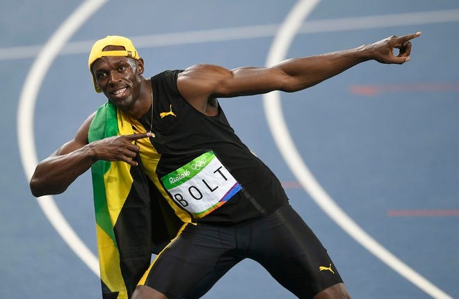 Jamaica's Usain Bolt celebrates after winning the men's 100-meter dash at the Summer Olympics in Rio de Janeiro on Sunday night. AP Photo/Martin Meissner