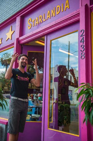 Clinton Edminster owner of Starlandia, a creative supply store on Bull Street just north of Victory, expresses frustration while explaining how his store had been vandalized on July 30th. (Josh Galemore/Savannah Morning News)