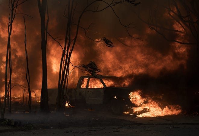 A truck burns in the town of Lower Lake, Calif. on Sunday. ASSOCIATED PRESS / JOSH EDELSON