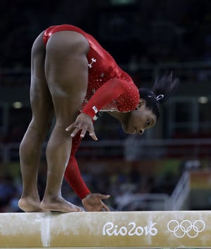 United States gymnast Simone Biles stumbles during her balance beam routine on Monday at the Summer Olympics in Rio de Janeiro. Biles, who had already won three gold medals during these Games, was awarded the bronze.