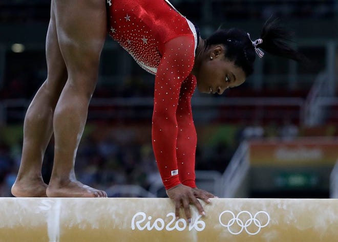 United States' Simone Biles stumbles on her balance beam routine during the artistic gymnastics women's apparatus final at the 2016 Summer Olympics in Rio de Janeiro, Brazil, Monday, Aug. 15, 2016. (AP Photo/Rebecca Blackwell)