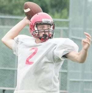 Stark County quarterback John Groter fires a pass during Saturday’s practice.