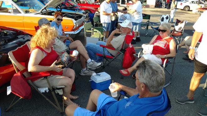 Folks attending the Tri State Car Cruise park their cars, grab their Dunkin Donuts iced coffee or tea, unfold their lawn chairs and form a circle where the conversation can be about anything from upcoming shows, what's new on their cars, or who is going to take the 50/50 prize that night. DONNA KESSLER/TIMES HERALD-RECORD