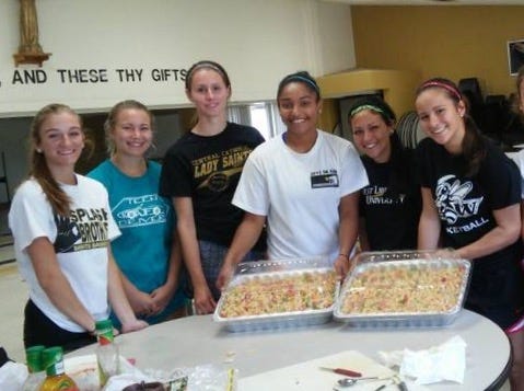Tuscarawas Central Catholic Junior Senior High School football and volleyball players recently made pasta salad to feed those at the Friends of the Homeless of Tuscarawas County. Pictured, from left: Alyssa Teater, Katie Churilla, Sydney Giland, Maggie Dominick, Morgan Harrison and Brooke Beamer. PHOTO PROVIDED
