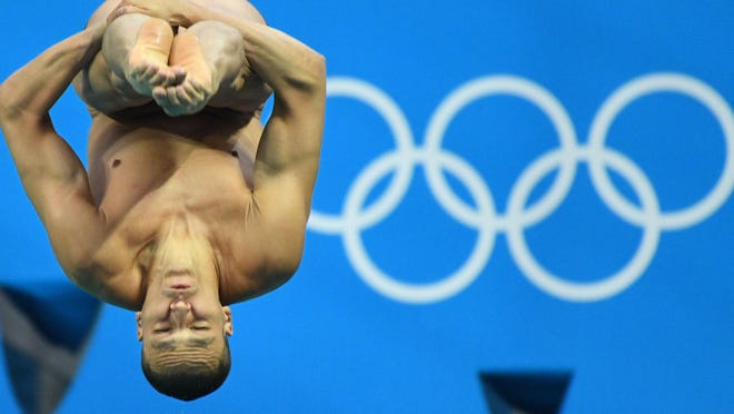 Georgia volunteer coach César Castro of Brazil qualified for the semifinals in the men's 3-meter springboard diving preliminaries at the Olympics Monday.