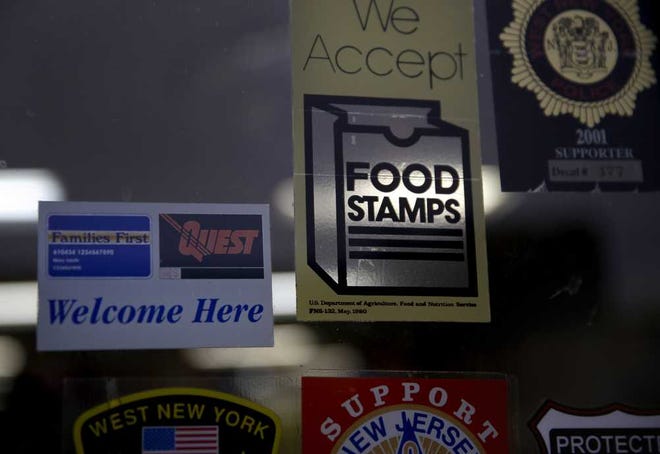 A supermarket displays stickers indicatin. (AP Photo/Seth Wenig)