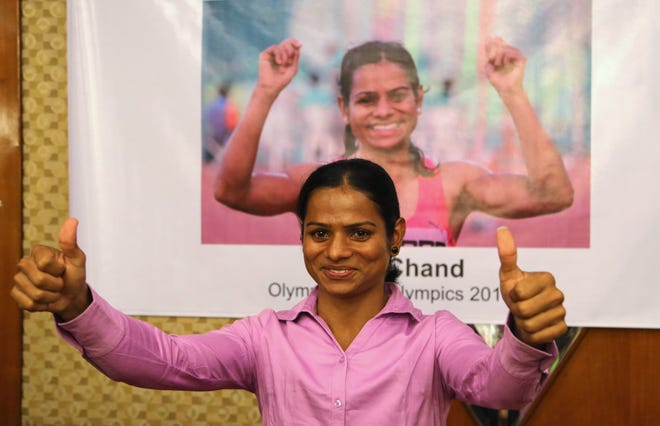 Indian athlete Dutee Chand gestures at a felicitation event in Bangalore, India in July. The Indian sprinter has qualified for the Olympics after the Court of Arbitration for Sport issued a landmark ruling that challenged her suspension for hyperandrogenism a condition which produces higher than normal testosterone levels in women. ASSOCIATED PRESS FILE / AIJAZ RAHI