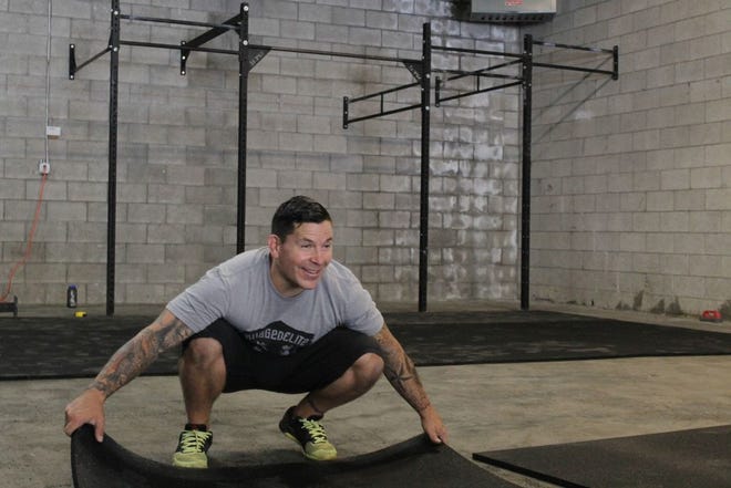 Scott Rodriguez moves 100 pound floor mats into place while setting up his new StoneWay CrossFit training facility on Ream Ave. in Mount Shasta. He and his wife Katie, who also have a CrossFit in Seattle, Wash., have scheduled a Mount Shasta grand opening for Saturday, Aug. 20, beginning at 10 a.m.