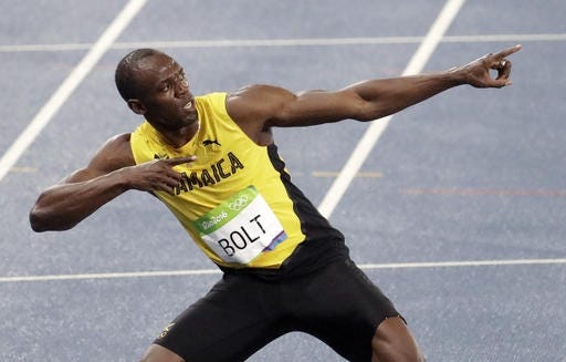 Jamaica's Usain Bolt displays his signature pose after winning the gold medal in the men's 200-meter final on Thursday night.