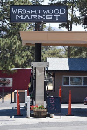 "Sorry Out of Gas" is posted at the gas pumps at the Wrightwood Market on Thursday. David Pardo, Daily Press