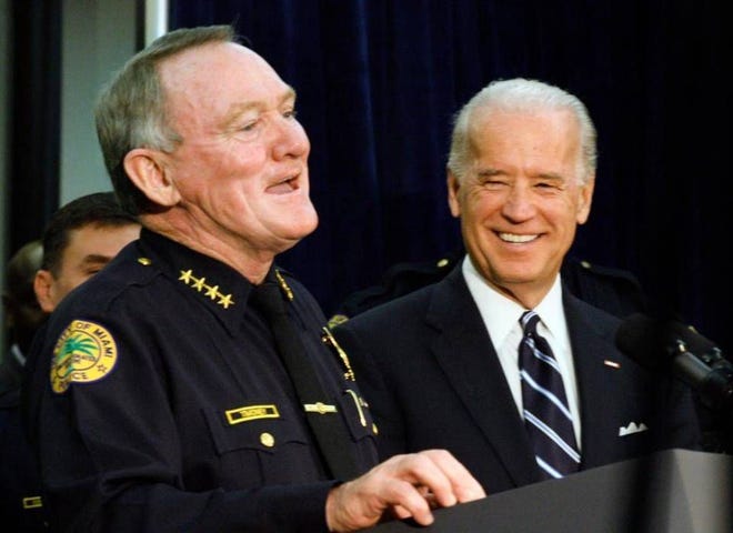 John Timoney (left) with Vice President Joe Biden. Timoney, the former Philadelphia Police commissioner, died Tuesday.