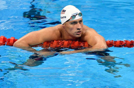 FILE - In this Aug. 9, 2016, file photo, United States' Ryan Lochte checks his time after a men' 4x200-meter freestyle relay heat during the swimming competitions at the 2016 Summer Olympics in Rio de Janeiro, Brazil. A Brazilian police official told The Associated Press that Lochte fabricated a story about being robbed at gunpoint in Rio de Janeiro. (AP Photo/Martin Meissner, File)
