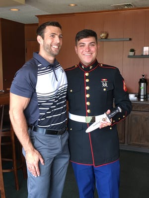 Lance Cpl. Dillon A. Thomakos recently received a custom Warther Commando Knife from Warther Cutlery. Pictured, from left: Warther Cutlery President Steven Cunningham and Thomakos. PHOTO PROVIDED