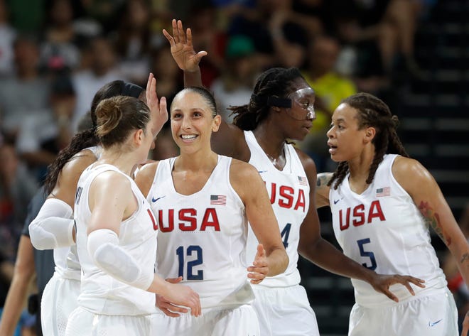 United States' Diana Taurasi (12) celebrates with teammates during a women's gold medal basketball game against Spain at the 2016 Summer Olympics in Rio de Janeiro, Brazil, Saturday, Aug. 20, 2016. (AP Photo/Eric Gay)