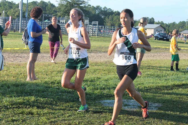 The county fairgrounds site is a good one for runners and spectators. While it is largely Florida-flat, there are a couple undulations that offer challenge and the course can be a little muddy after a couple of days of rain. Here Flagler Palm Coast's Anna Walls, right, runs the course during last year's Spikes and Spurs Classic at the Flagler County fairgrounds. NEWS-TRIBUNE FILE