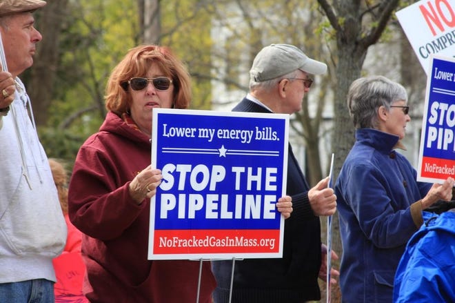 Nancy Cameron, from North Weymouth, protests against Spectra's planned pipeline and compressor station outside Weymouth Town Hall in April 2016. Wicked Local file photo
