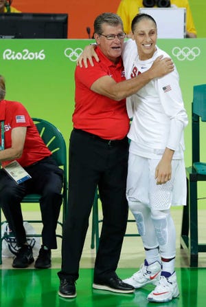 United States' Diana Taurasi, right, celebrates with head coach Geno Auriemma after winning the gold medal game over Spain on Saturday at the Summer Olympics in Rio de Janeiro.